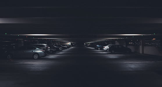 vehicles parked on parking area thumbnail