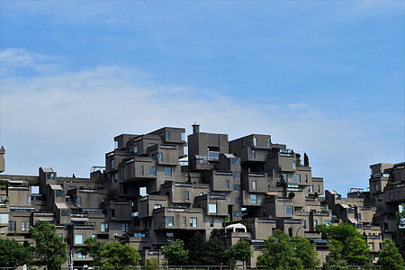 gray painted building under blue sky thumbnail
