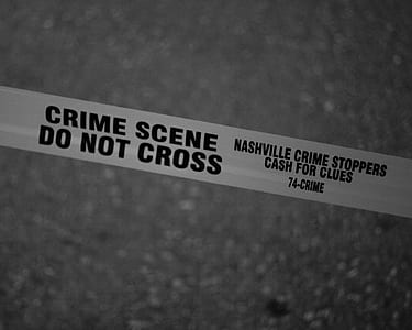 Grayscale Photo of Crime Scene Do Not Cross Tape thumbnail