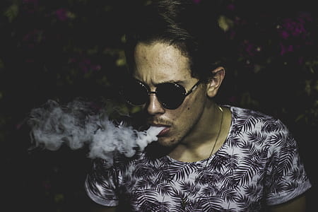 man blowing smoke thumbnail