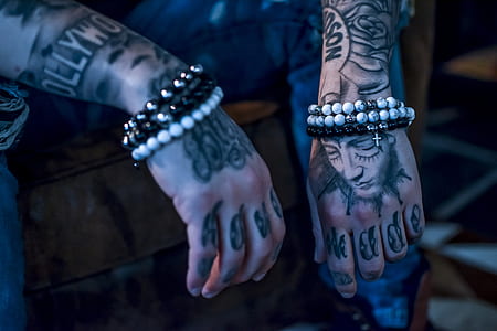 man wearing beaded bracelets thumbnail