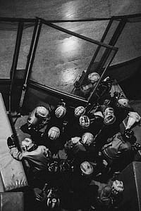 Grayscale Photo of Persons in Jersey Shirt thumbnail