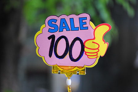 selective focus photo of sale 100 signage thumbnail