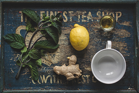 lemon and ginger on gray wooden tray thumbnail