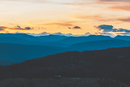 forest and mountains during sunset thumbnail