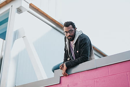 man on pink and gray ledge thumbnail