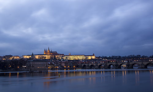 gray concrete bridge and city buildings at blue hour thumbnail