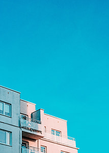 concrete building under clear blue skies thumbnail