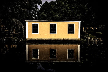 Beige and White House Beside Body of Water thumbnail