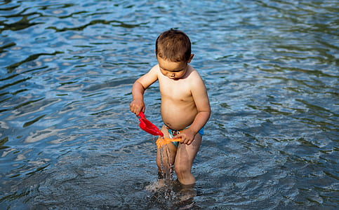 boy playing on water thumbnail