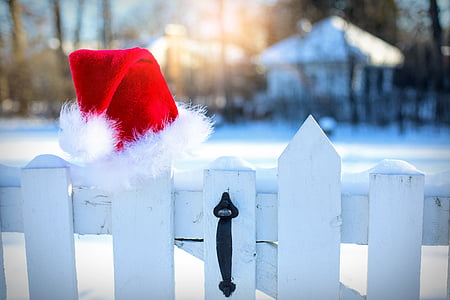 white wooden fence with santa hat on top thumbnail
