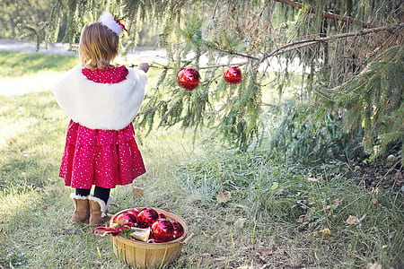 girl in white and red dress and pair of brown boots standing near basket thumbnail