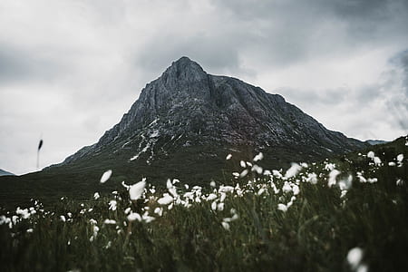 landscape photography of gray mountain under cloudy sky during daytime thumbnail