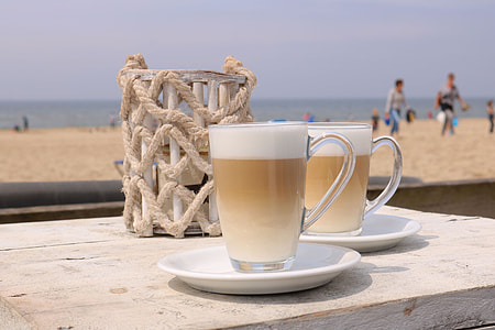 cup filled with cappuccino thumbnail