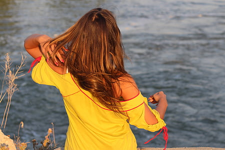 woman near body of water at daytime thumbnail
