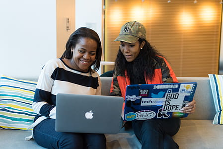 Two Women Holding Laptop thumbnail