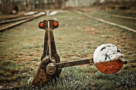 black metal tool on green grass thumbnail