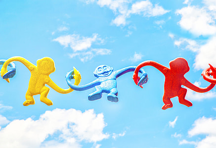 three red, blue, and blue primate figurine thumbnail