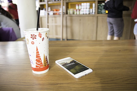 silver iPhone 6 and white plastic cup thumbnail