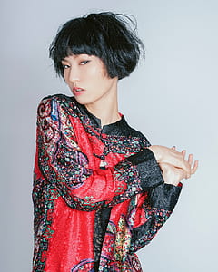 woman in red and black floral long-sleeved top thumbnail