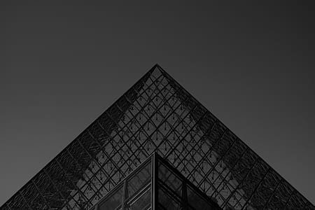 grayscale photography of triangular glass structure thumbnail