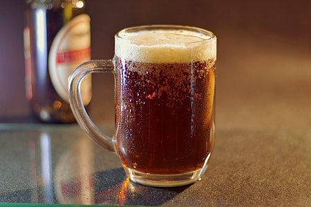 clear glass mug with brown liquid thumbnail