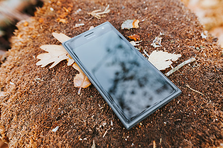 Black mobile phone on the ground thumbnail