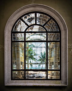 clear glass window with black steel frame showing green trees during daytime thumbnail