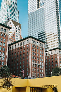 brown and white high rise building under blue sky at daytime thumbnail