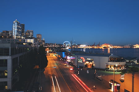 timelapse photography of city buildings during nighttime thumbnail