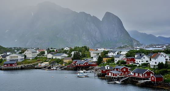 photo of town beside seashore apart from mountain thumbnail