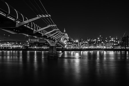 grayscale photo of bridge near cityscape thumbnail