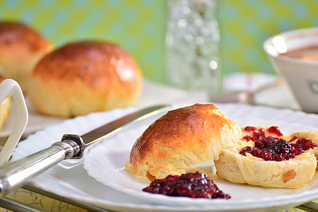 shallow focus photography of bread with red jam on plate thumbnail
