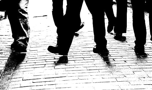 silhouette of human feet walking on ground thumbnail