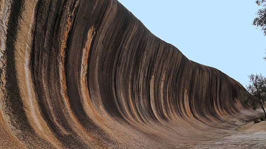 rock wave formation under blue sky thumbnail