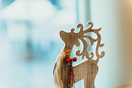 selective focus photography brown wooden deer figurine thumbnail