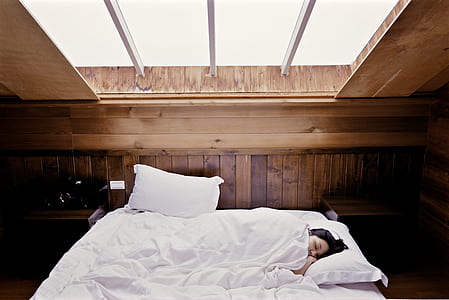 white bed comforter and pillows thumbnail