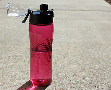 red and black opened sports bottle with liquid inside thumbnail