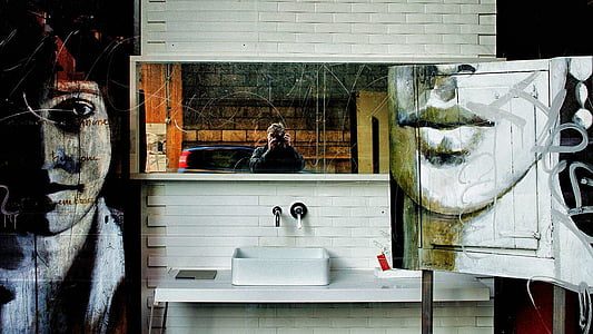three paintings hanged on wall thumbnail
