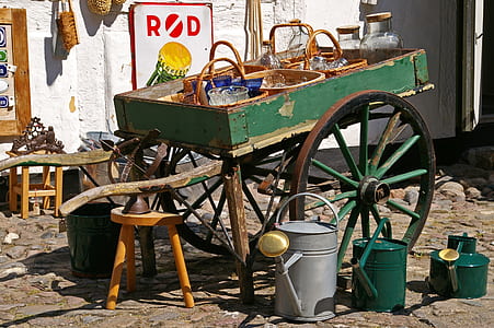 wicker baskets on green wooden trailer thumbnail
