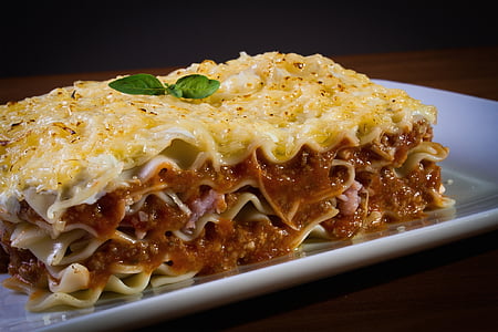 Lasagna on top of white ceramic plate thumbnail