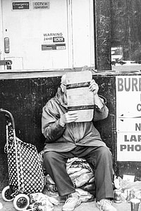 grayscale photography of man holding paper thumbnail
