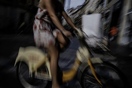 woman riding yellow and white bike thumbnail