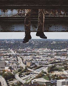 person wearing pair of black shoes thumbnail