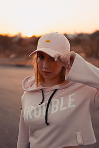 Woman Wearing Pink Pullover Hoodie thumbnail