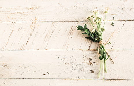 white flower bouquet on white wooden surface thumbnail