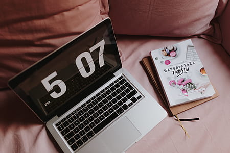 Workplace with a laptop on a pink couch thumbnail