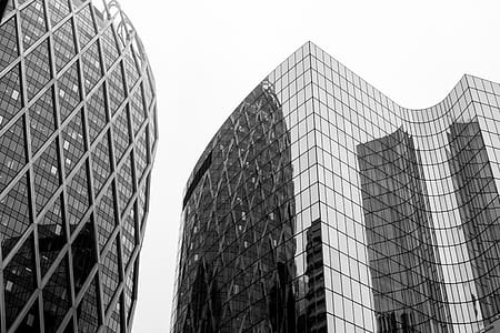 Greyscale Photo Of Glass Window Buildings thumbnail